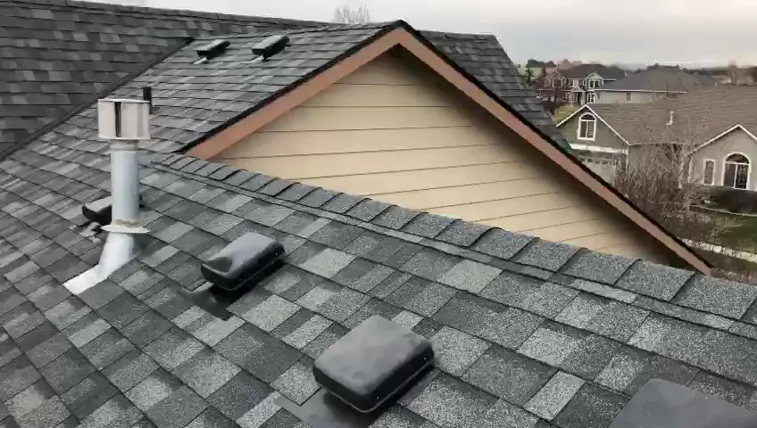 Gray asphalt shingle roof with box vents and a flashed plumbing vent pipe
